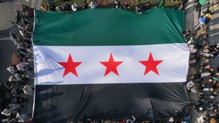 قصة علم سوريا الجديد